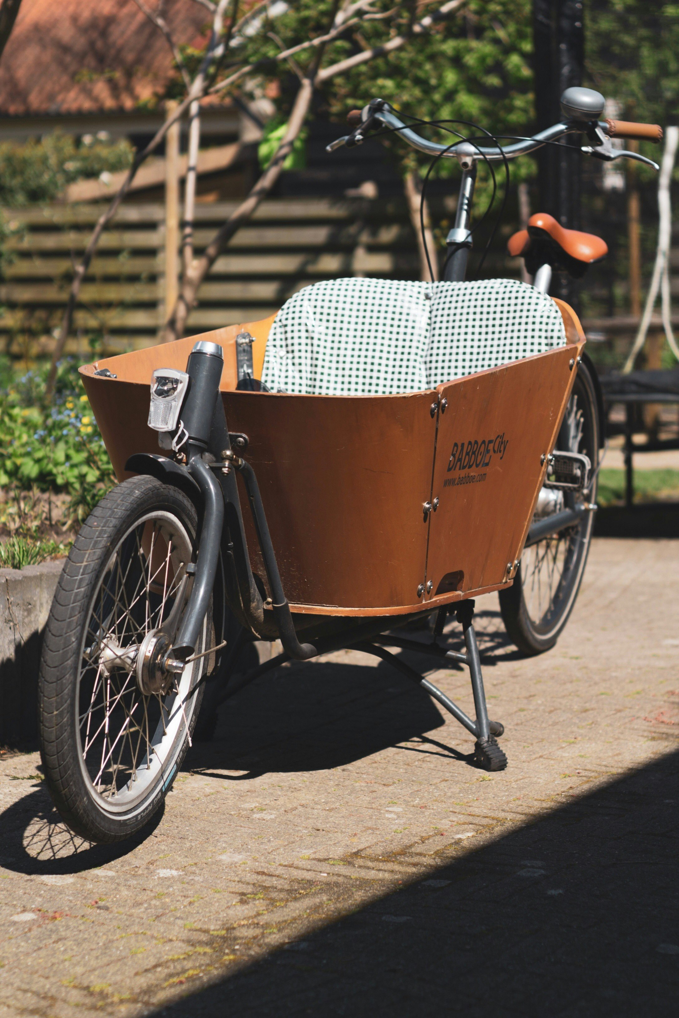 brown bicycle with trailer